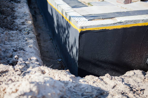 Professional Basement Waterproofing technician working in North Newton, KS